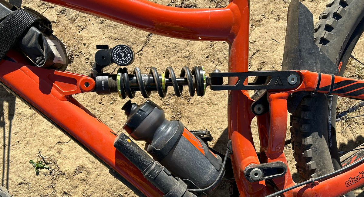 Adapt mullet link installed on an orange Ibis Ripmo AF, with a DVO Jade coil shock fitted.